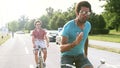 Three young adults having fun cycling, graded