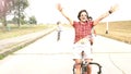 Three young adults having fun cycling on their bike, graded