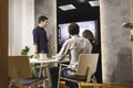 Closeup of young architects discussing together inside a conference room Royalty Free Stock Photo