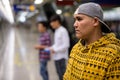 Three young Asian men inside the subway train station Royalty Free Stock Photo