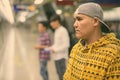 Three young Asian men inside the subway train station Royalty Free Stock Photo