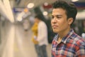 Three young Asian men inside the subway train station Royalty Free Stock Photo