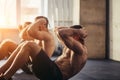 Group of athletic adult men and women performing sit up exercises Royalty Free Stock Photo