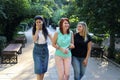 Three young beautiful women friends in the park Royalty Free Stock Photo