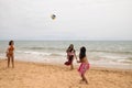 Three young and beautiful women playing boley on the shore of the beach. The women are enjoying the game and their day at the Royalty Free Stock Photo