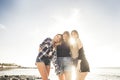 Three young beauty women at the beach join the summer