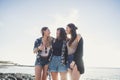 Three young beauty women at the beach join the summer