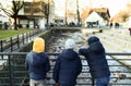 Three young boys on a bridge