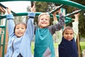 Three Young Boys On Climbing Frame In Playground Royalty Free Stock Photo