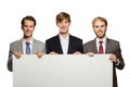 Three young businessman standing with a blank whiteboard , isola Royalty Free Stock Photo