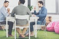 Three young businessmen sitting at table and working on new project together business Royalty Free Stock Photo