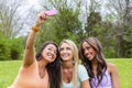 Three Young College Students Enjoying Each Others Company In Between Classes Royalty Free Stock Photo