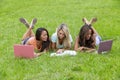 Three Young College Students Enjoying Each Others Company In Between Classes Royalty Free Stock Photo