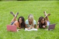 Three Young College Students Enjoying Each Others Company In Between Classes Royalty Free Stock Photo