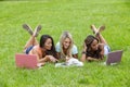 Three Young College Students Enjoying Each Others Company In Between Classes Royalty Free Stock Photo