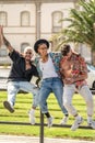 Three young fashionable crazy friends having fun together, laughing. Students. City break Royalty Free Stock Photo