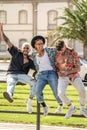 Three young fashionable crazy friends having fun together, laughing. Students. City break Royalty Free Stock Photo