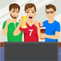 Three young friends watching sports game