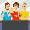 Three young friends watching sports game Royalty Free Stock Photo