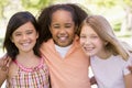 Three young girl friends outdoors