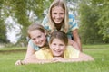 Three young girl friends piled on each Royalty Free Stock Photo