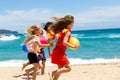 Three young girlfriends running on beach. Royalty Free Stock Photo