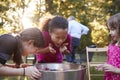 Three young girls apple bobbing at a backyard party Royalty Free Stock Photo