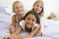 Three Young Girls Lying On Top Of Each Other