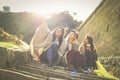 Three young girls sitting on the stairs. Royalty Free Stock Photo
