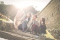 Three young girls sitting on the stairs. Royalty Free Stock Photo