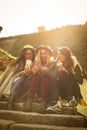 Three young girls sitting on the stairs. Royalty Free Stock Photo