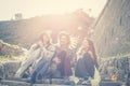 Three young girls sitting on the stairs. Royalty Free Stock Photo