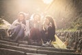 Three young girls sitting on the stairs. Royalty Free Stock Photo