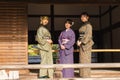 three young Japanese women in traditional Kimono clothes