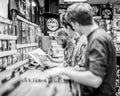 Young men looking at vinyl records in a store or shop. Royalty Free Stock Photo