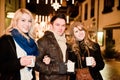 Three young People drinking Punch Royalty Free Stock Photo