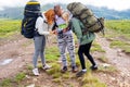 Three young people of tourists friends a guy and two girls blond Royalty Free Stock Photo