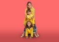 Three young siblings in yellow raincoats Royalty Free Stock Photo