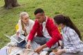Three young students discussing their student life Royalty Free Stock Photo