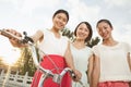 Three Young Women with Bicycle Royalty Free Stock Photo