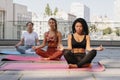 Three young women doing yoga outdoors. Royalty Free Stock Photo