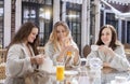 Three young women drinking tea at spa resort Royalty Free Stock Photo