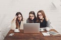 Three young women friends with laptop. Royalty Free Stock Photo