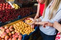 Three young women at grocery market.