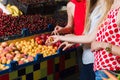 Three young women at grocery market.