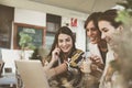 Three young women having conversation in cafe. Royalty Free Stock Photo