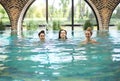 Three young women in the swimming pool Royalty Free Stock Photo