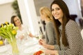 Three young women toasting with white wine Royalty Free Stock Photo