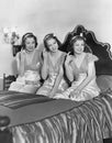 Three young women winking