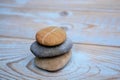 Three zen stones on old wood
